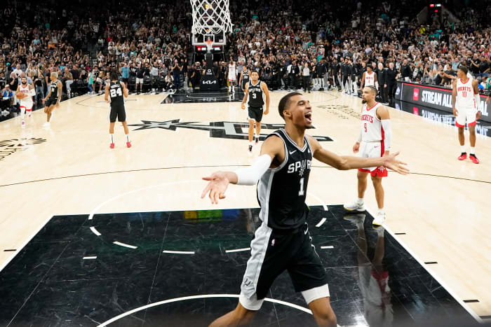 Oct 27, 2023; San Antonio, Texas, USA; San Antonio Spurs forward Victor Wembanyama (1) celebrates his first NBA victory after the Spurs defeated the Houston Rockets at Frost Bank Center.